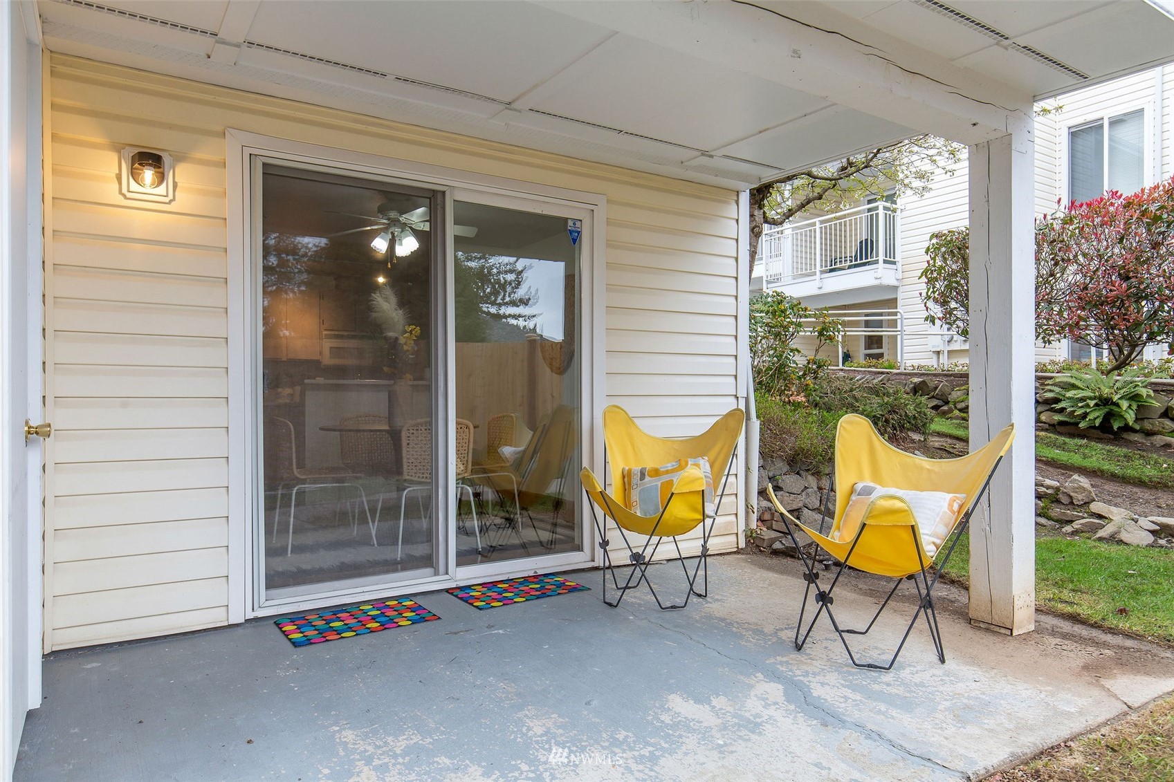 11002 Southeast Petrovitsky Road, Unit C101 Renton, WA 98055 - Photo 12 of 24 a outdoor seating area with furniture and garden view