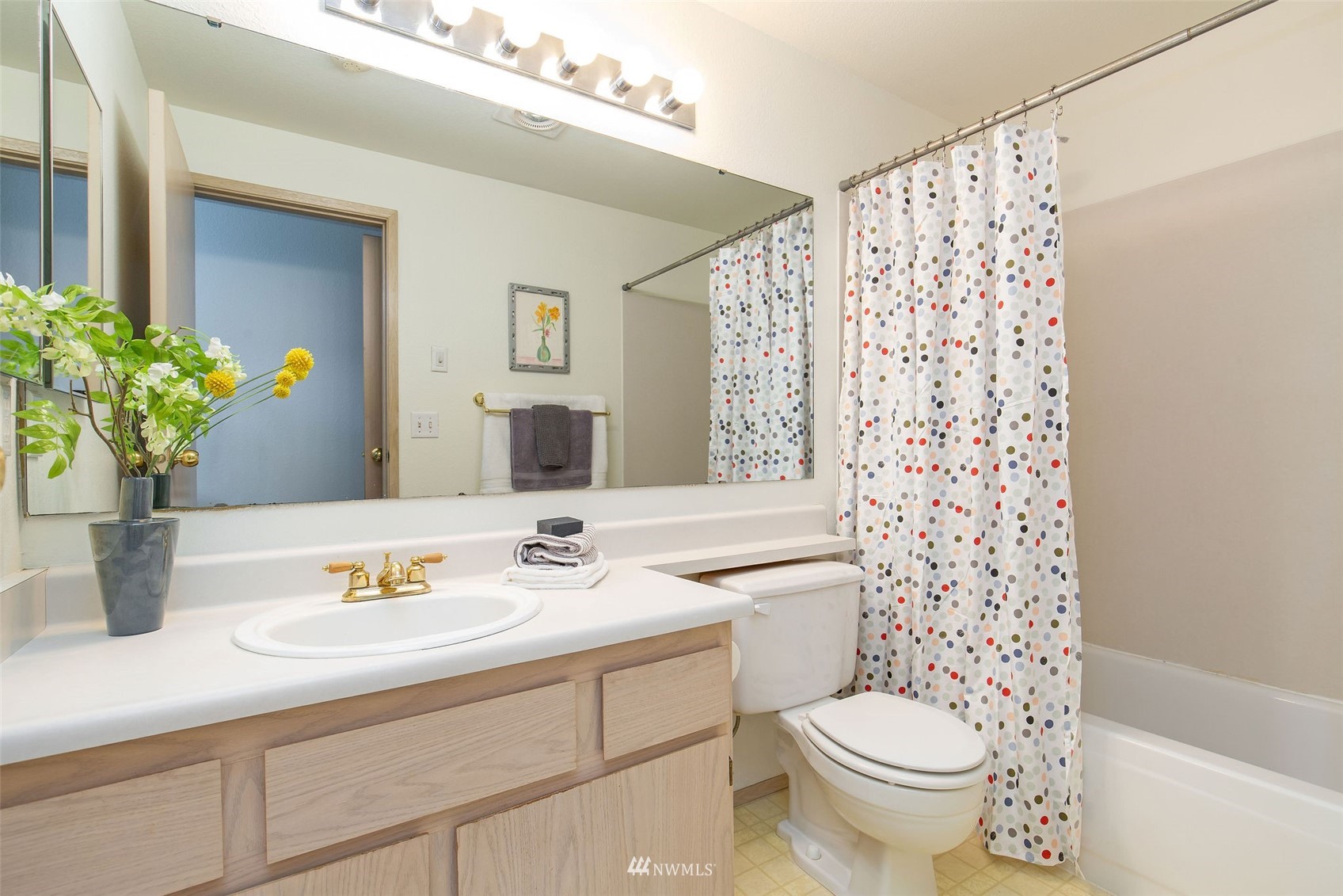 11002 Southeast Petrovitsky Road, Unit C101 Renton, WA 98055 - Photo 15 of 24 a bathroom with a sink a toilet and shower