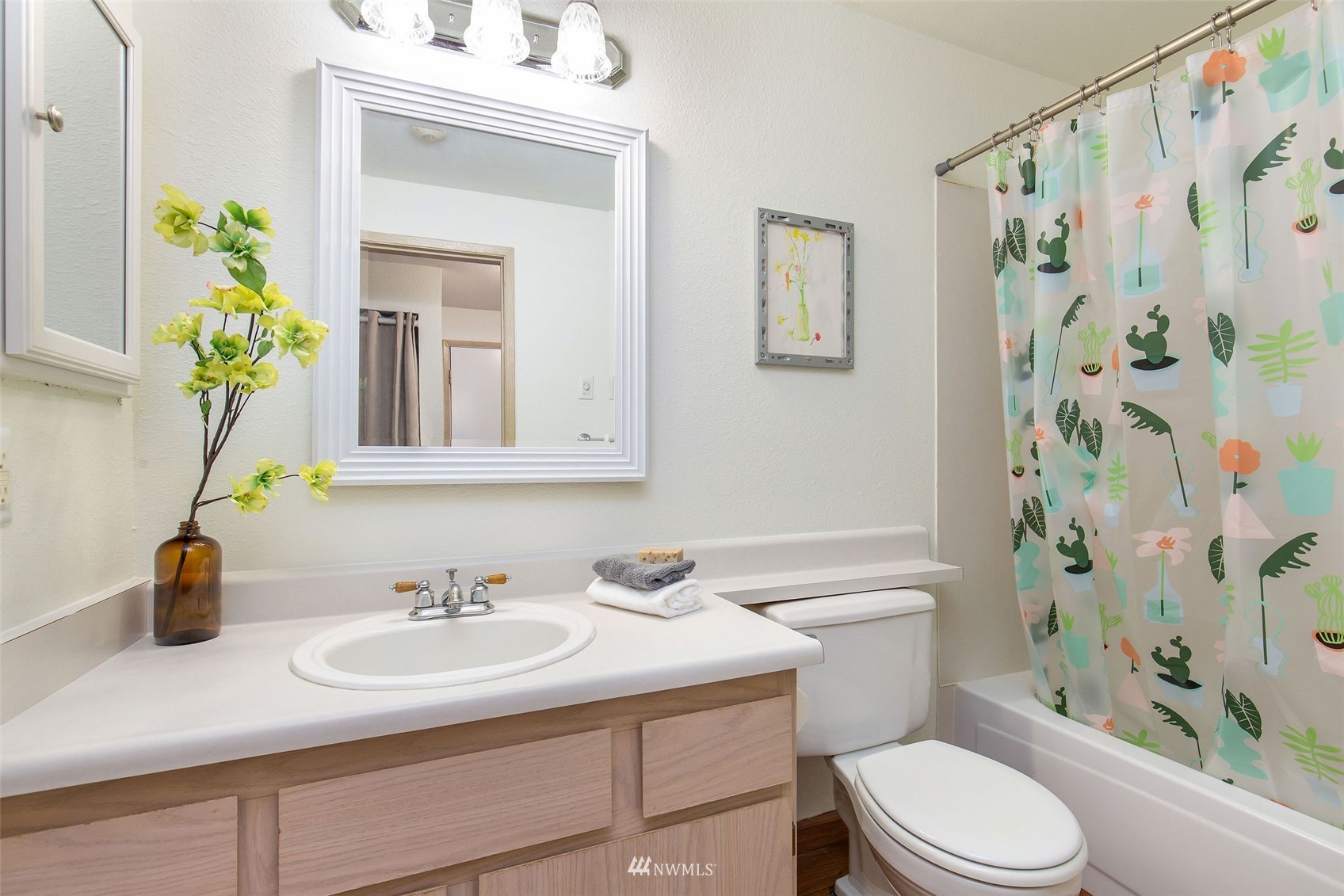 11002 Southeast Petrovitsky Road, Unit C101 Renton, WA 98055 - Photo 18 of 24 a bathroom with a sink toilet and shower