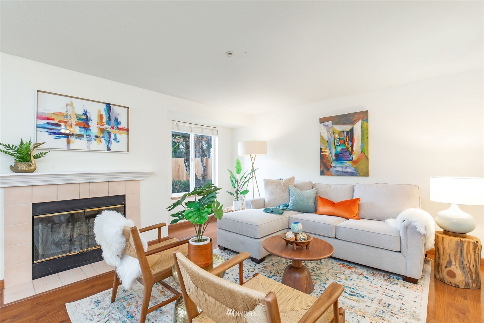 11002 Southeast Petrovitsky Road, Unit C101 Renton, WA 98055 - Photo 6 of 24 a living room with furniture and a fireplace