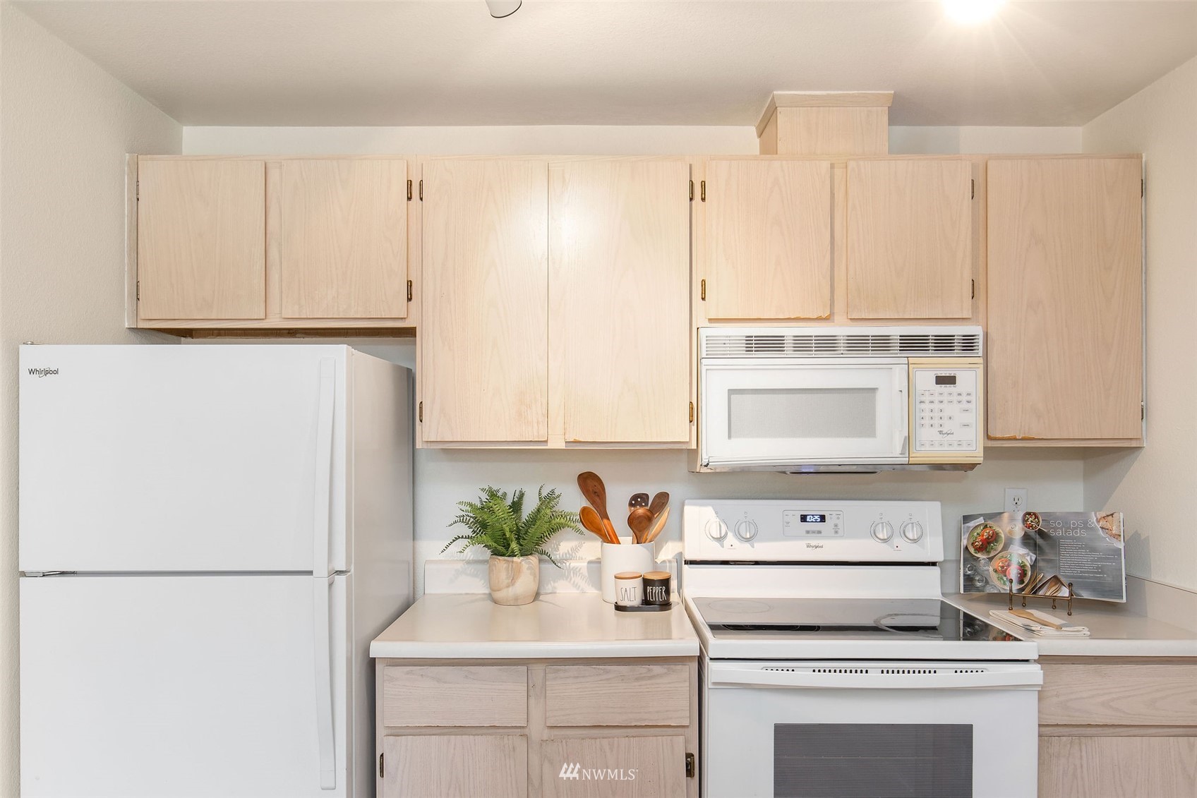 11002 Southeast Petrovitsky Road, Unit C101 Renton, WA 98055 - Photo 8 of 24 a kitchen with appliances cabinets and a sink
