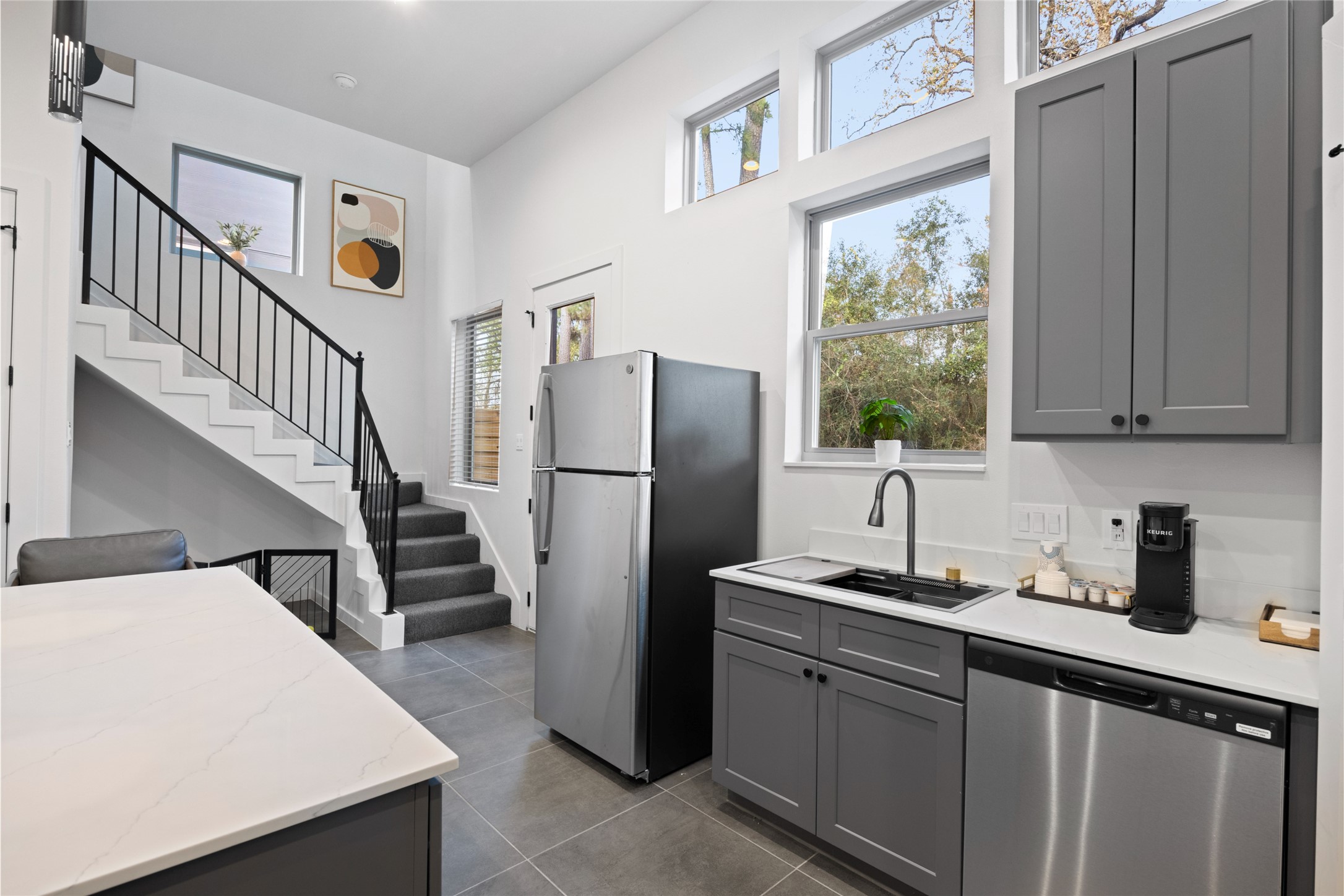 13107 Beauty Berry Ridge Lane Cypress, TX 77429 - Photo 10 of 33 a kitchen with sink a refrigerator and cabinets