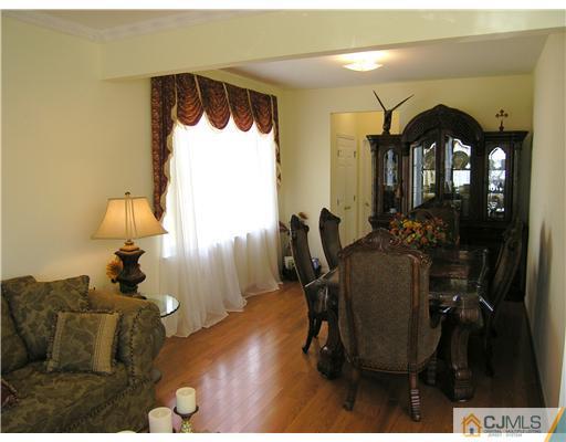 46 Lexington Road Monmouth Junction, NJ 08852 - Photo 4 of 10 a living room with furniture and a wooden floor