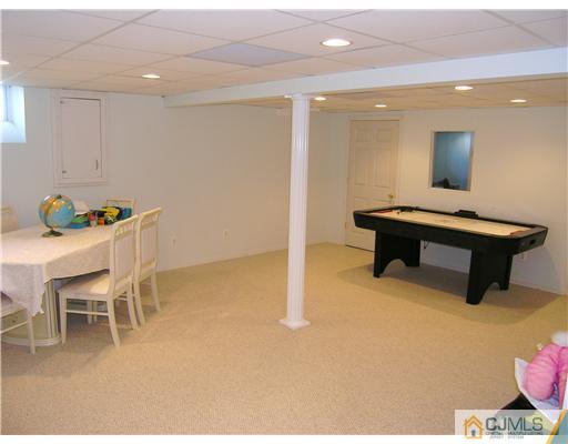 46 Lexington Road Monmouth Junction, NJ 08852 - Photo 9 of 10 a room with furniture and a table