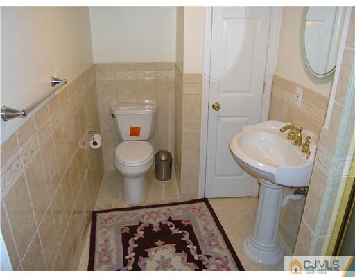 46 Lexington Road Monmouth Junction, NJ 08852 - Photo 10 of 10 a bathroom with a sink toilet and a mirror
