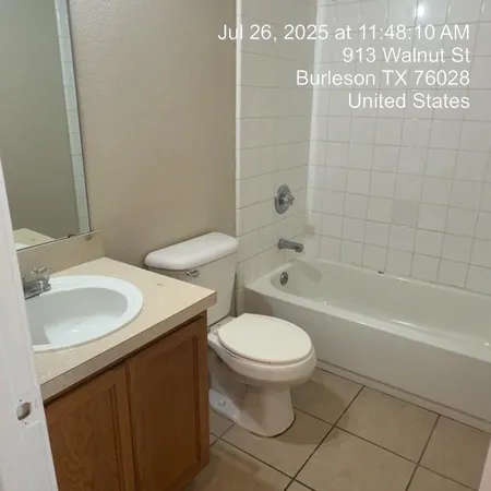 a bathroom with a sink a toilet and a bathtub
