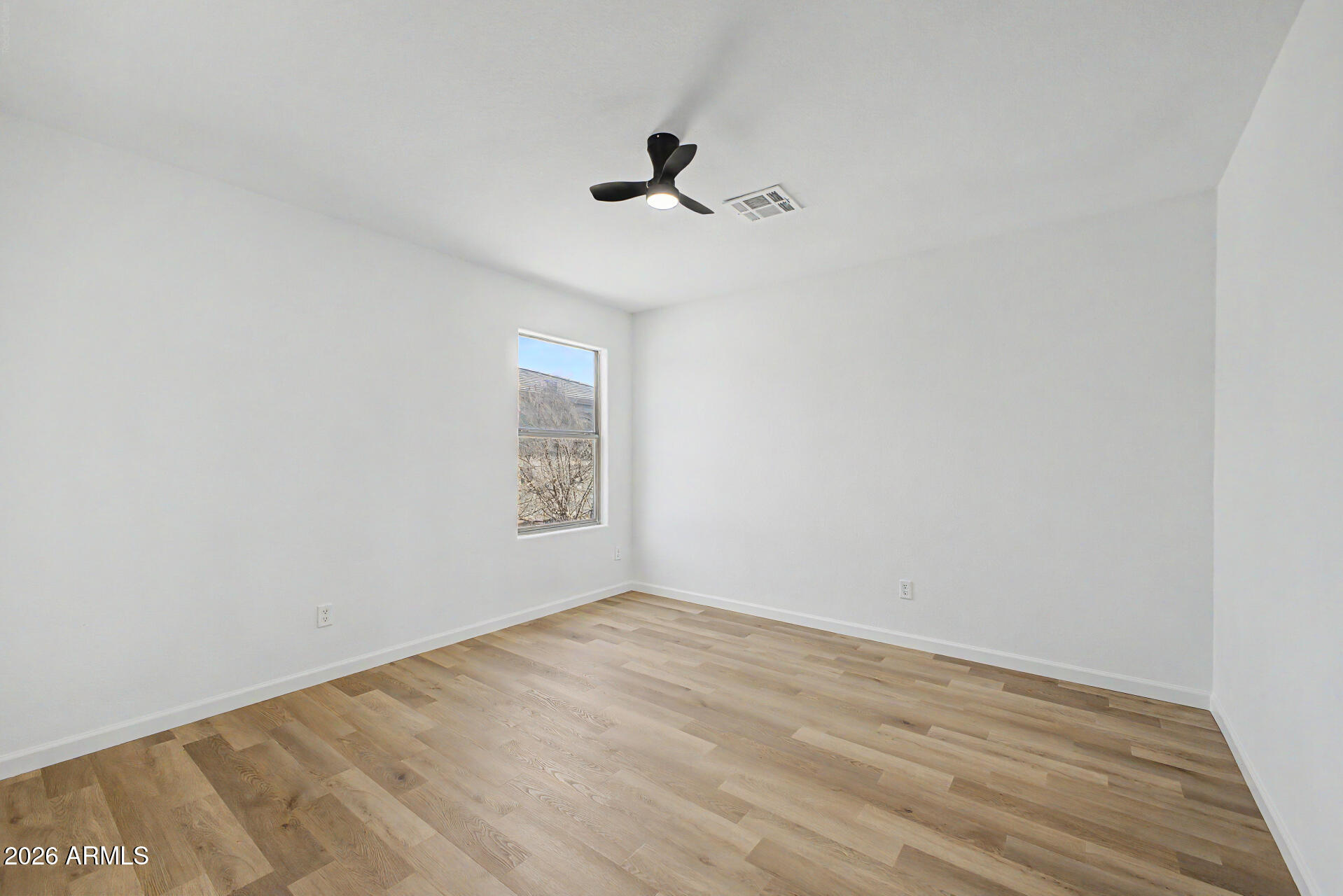 6452 West Ruth Avenue Glendale, AZ 85302 - Photo 26 of 35 an empty room with a window