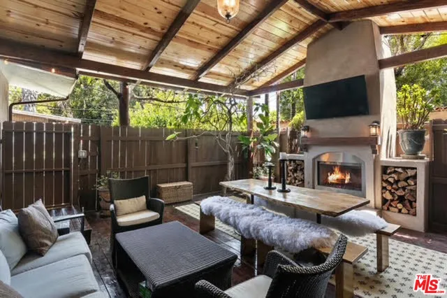a outdoor living space with furniture and a fireplace