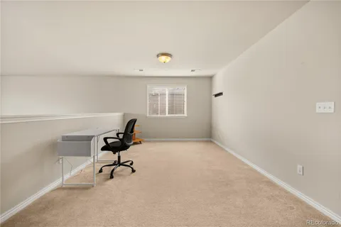 a view of empty room with wooden walls