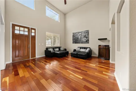 a view of a livingroom with furniture and a flat screen tv