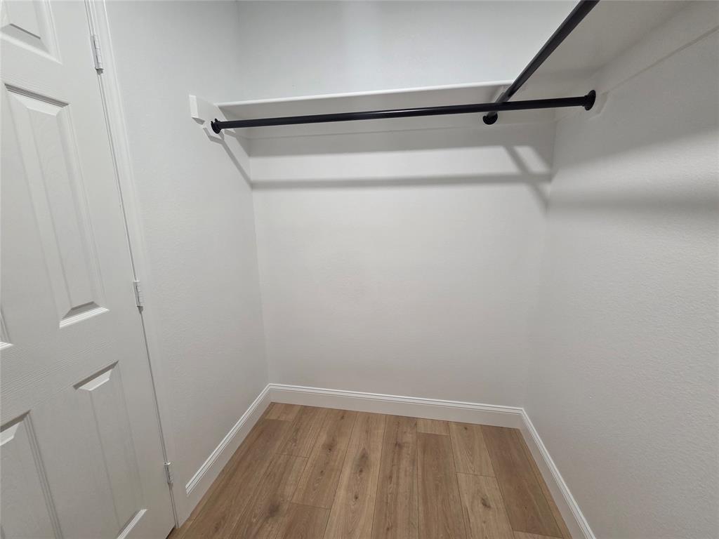 1745 East Cherry Street Paris, TX 75460 - Photo 19 of 40 a view of small space with racks on the wall