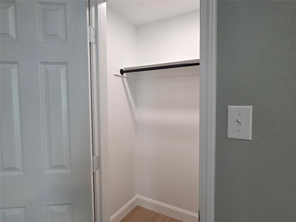 1745 East Cherry Street Paris, TX 75460 - Photo 25 of 40 a bathroom with a glass shower door