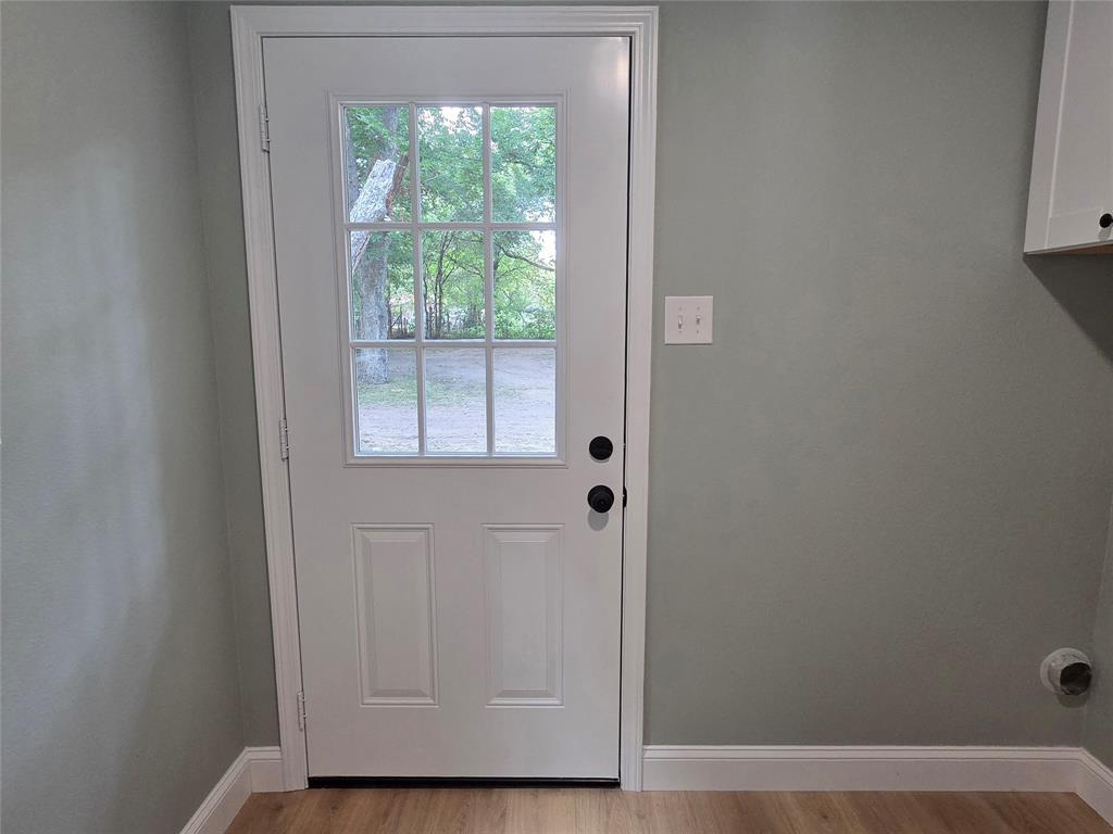 1745 East Cherry Street Paris, TX 75460 - Photo 33 of 40 a view of an entryway with wooden floor