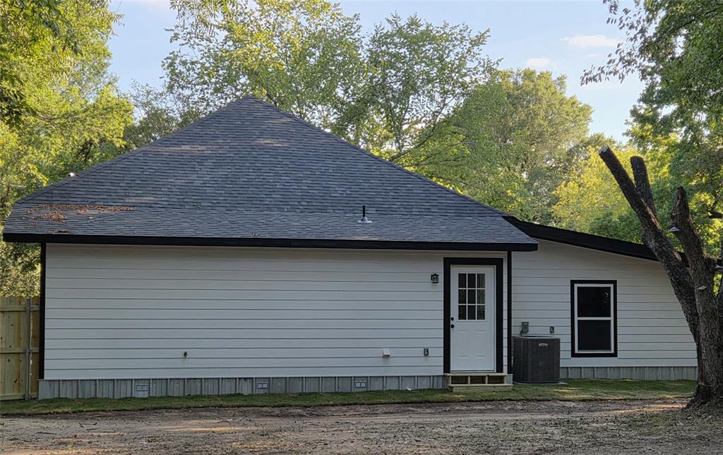 1745 East Cherry Street Paris, TX 75460 - Photo 36 of 40 a view of a house with a yard