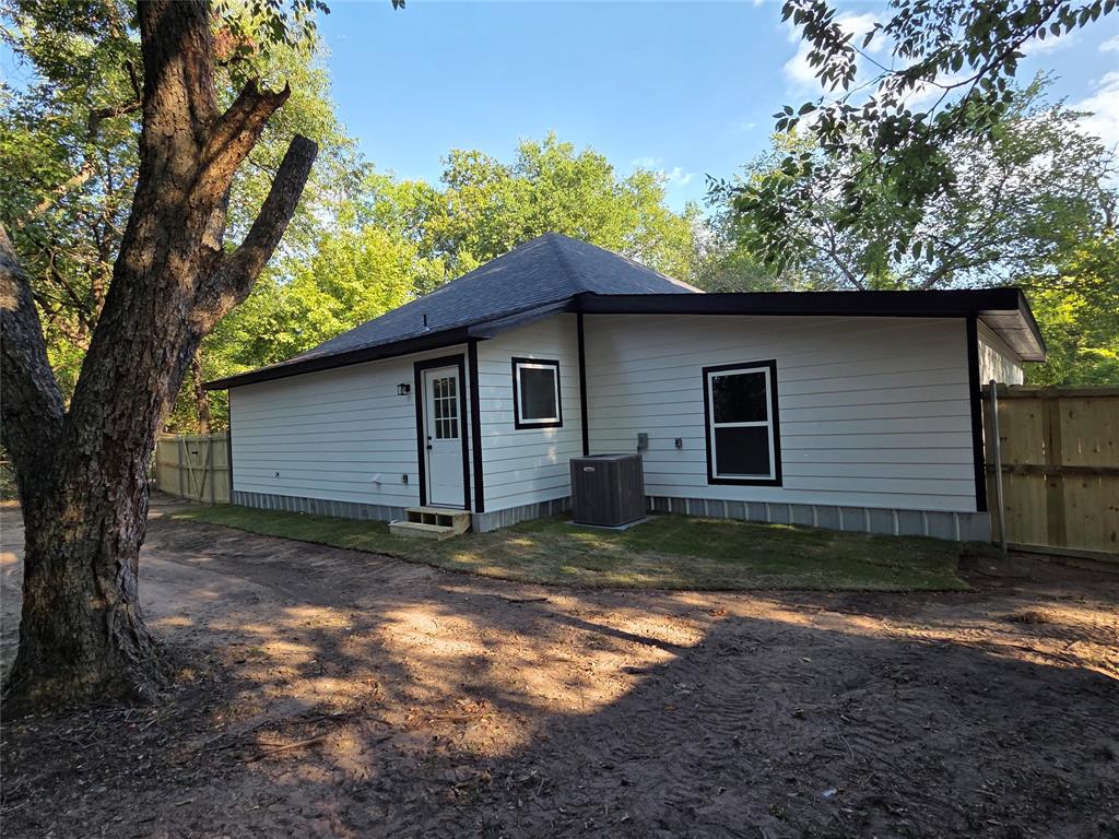 1745 East Cherry Street Paris, TX 75460 - Photo 37 of 40 a view of a house with a yard