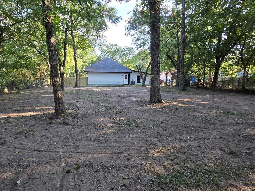1745 East Cherry Street Paris, TX 75460 - Photo 39 of 40 a road view with large trees