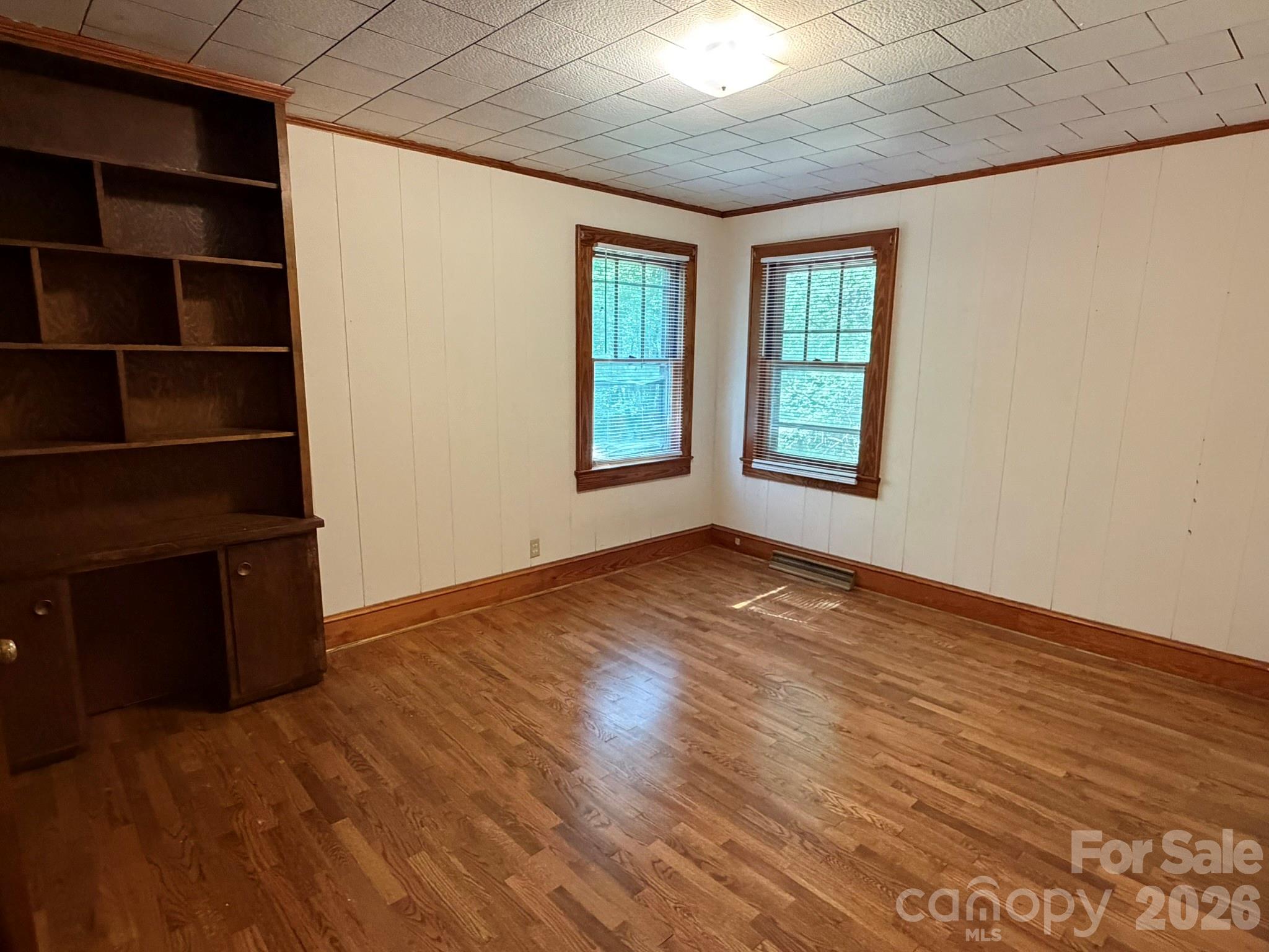 382 Alexis High Shoals Road Dallas, NC 28034 - Photo 25 of 43 an empty room with wooden floor and windows