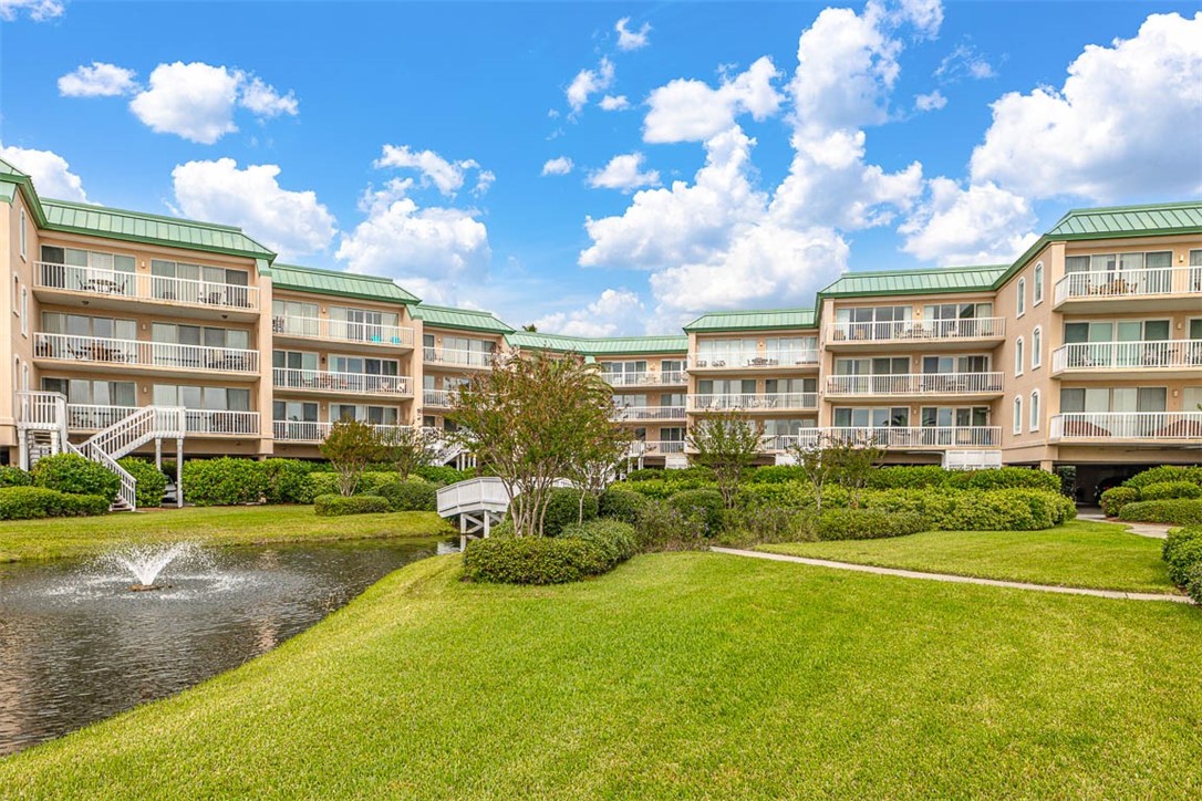 1400 Ocean Boulevard, Unit 219 St. Simons Island, GA 31522 - Photo 2 of 34 Lagoon and lush landscaping
