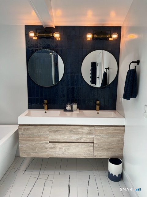 7 Old Turnpike Road South North Canaan, CT 06024 - Photo 19 of 20 a bathroom with a double vanity sink and mirror