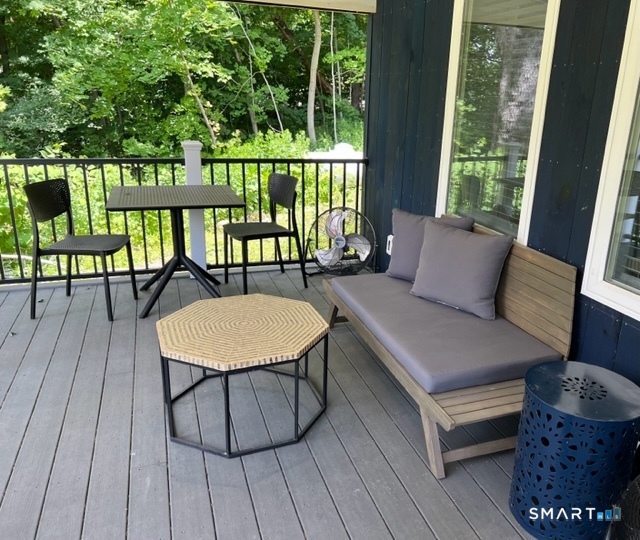 7 Old Turnpike Road South North Canaan, CT 06024 - Photo 4 of 20 a balcony with wooden floor table and chairs
