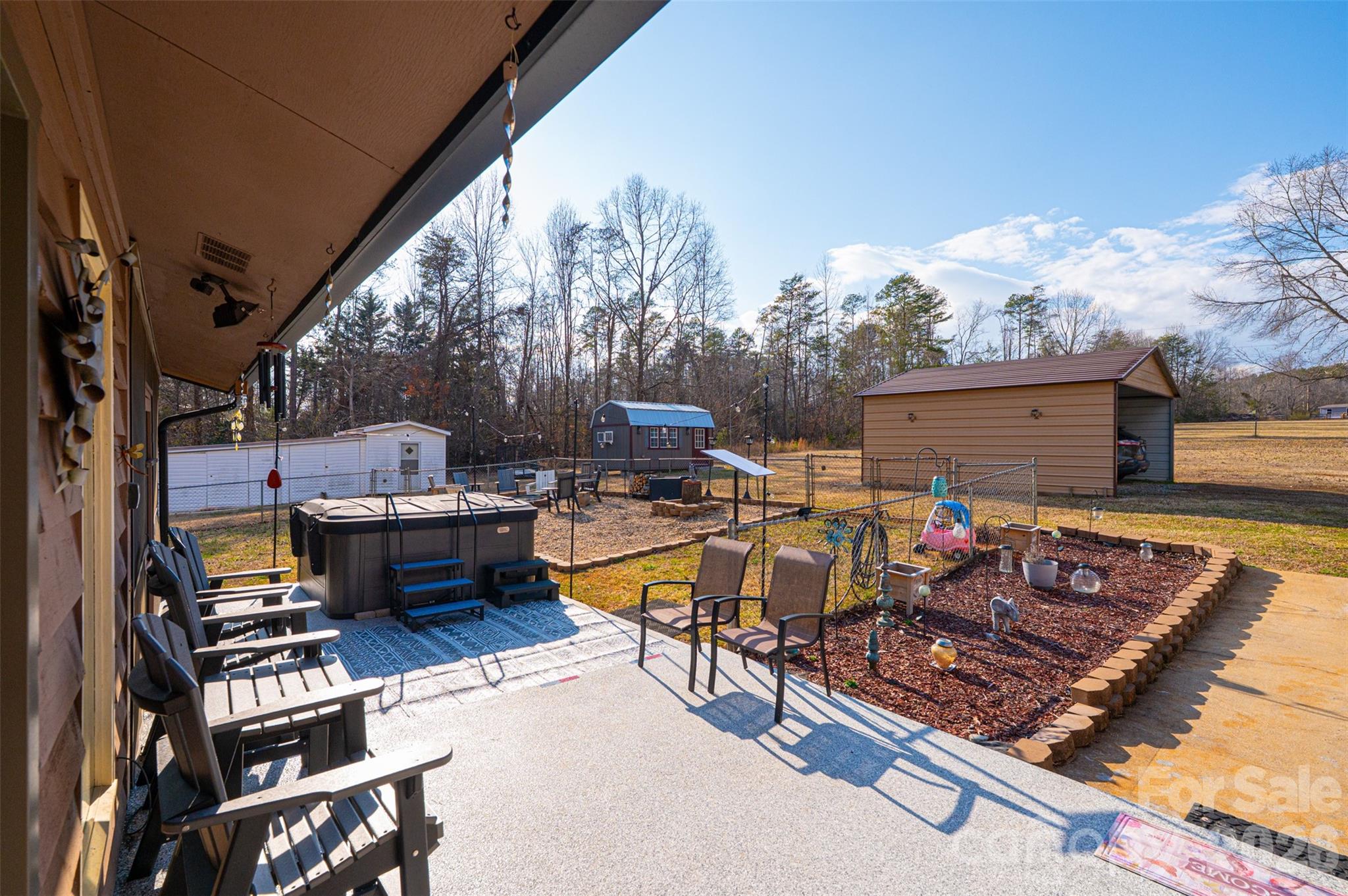 1689 Rock Road Rutherfordton, NC 28139 - Photo 18 of 47 a view of a patio with table and chairs and couches