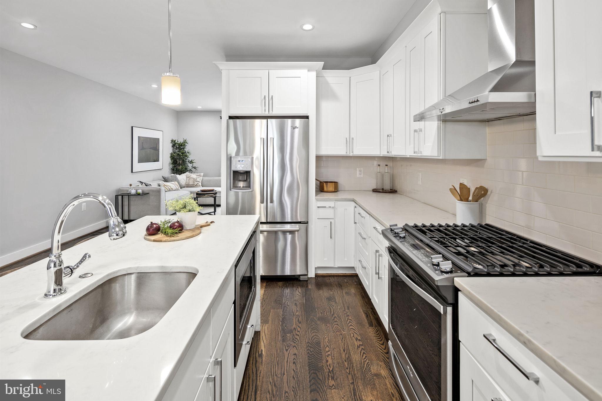 16 T Street Northeast, Unit 1 Washington, DC 20002 - Photo 17 of 48 Gas cooking range and hood