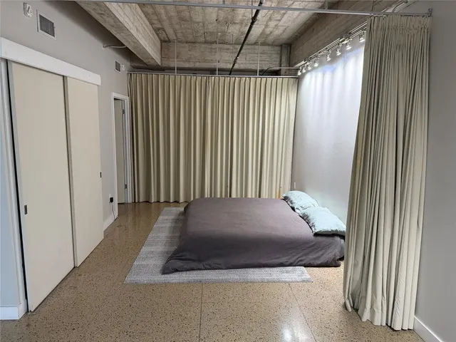 a bathroom with a toilet a sink and shower