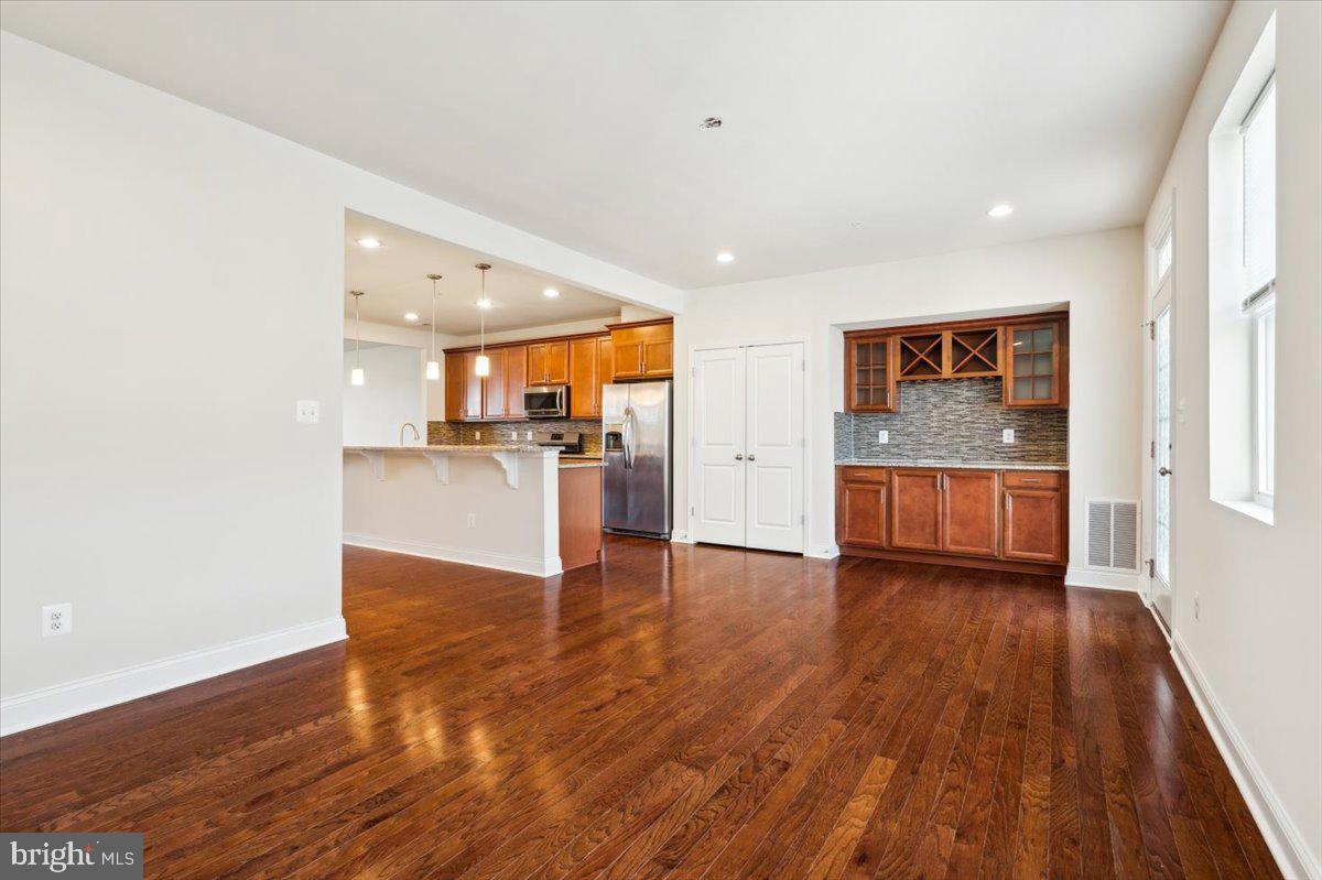 7142 Proclamation Place Frederick, MD 21703 - Photo 14 of 37 a view of a kitchen with a sink and a refrigerator