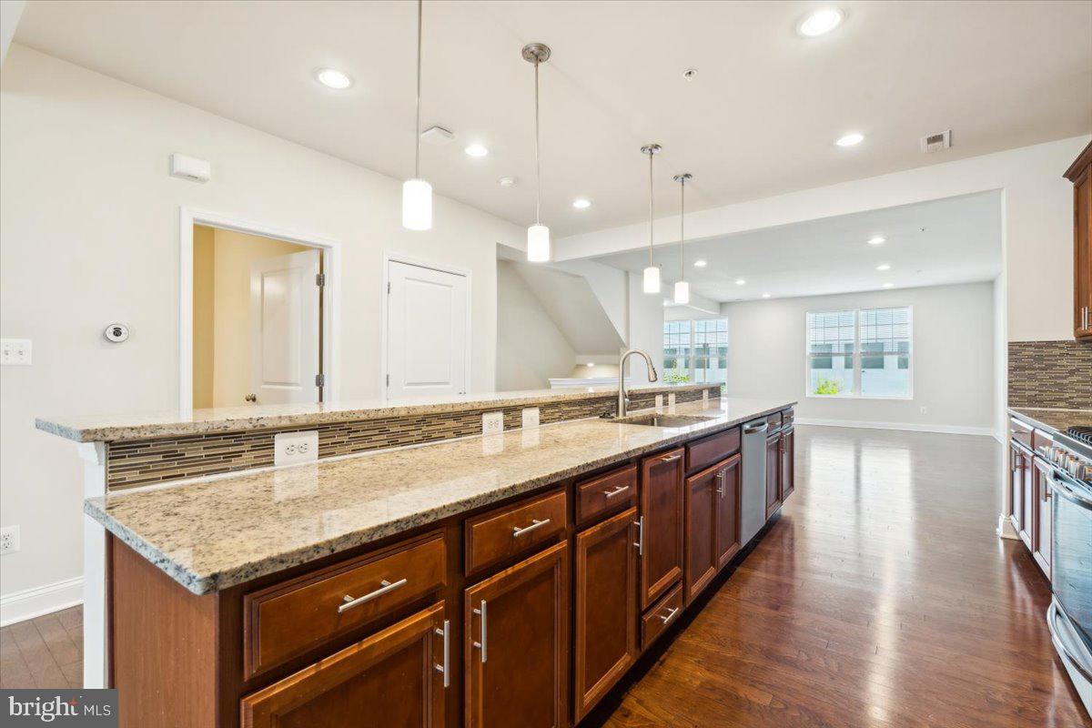 7142 Proclamation Place Frederick, MD 21703 - Photo 16 of 37 a bathroom with a sink and a large mirror