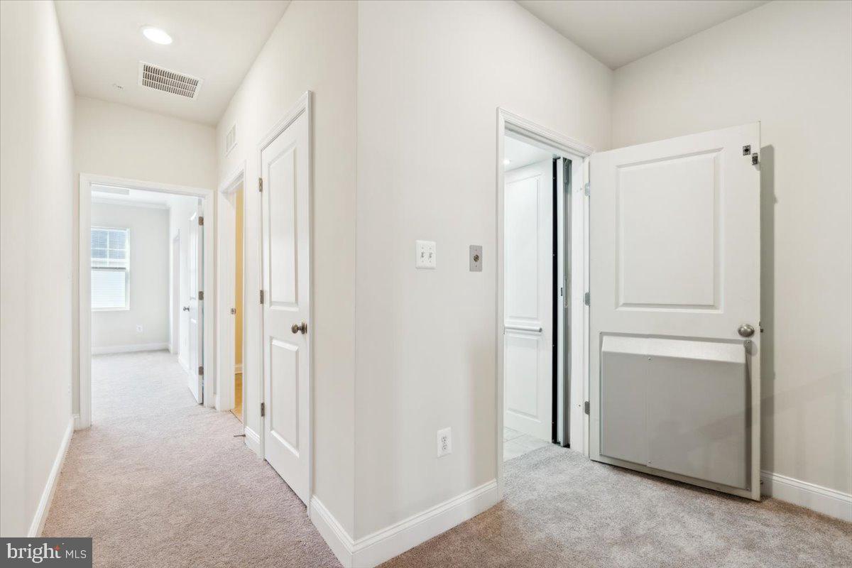 7142 Proclamation Place Frederick, MD 21703 - Photo 20 of 37 a view of a hallway with closet area