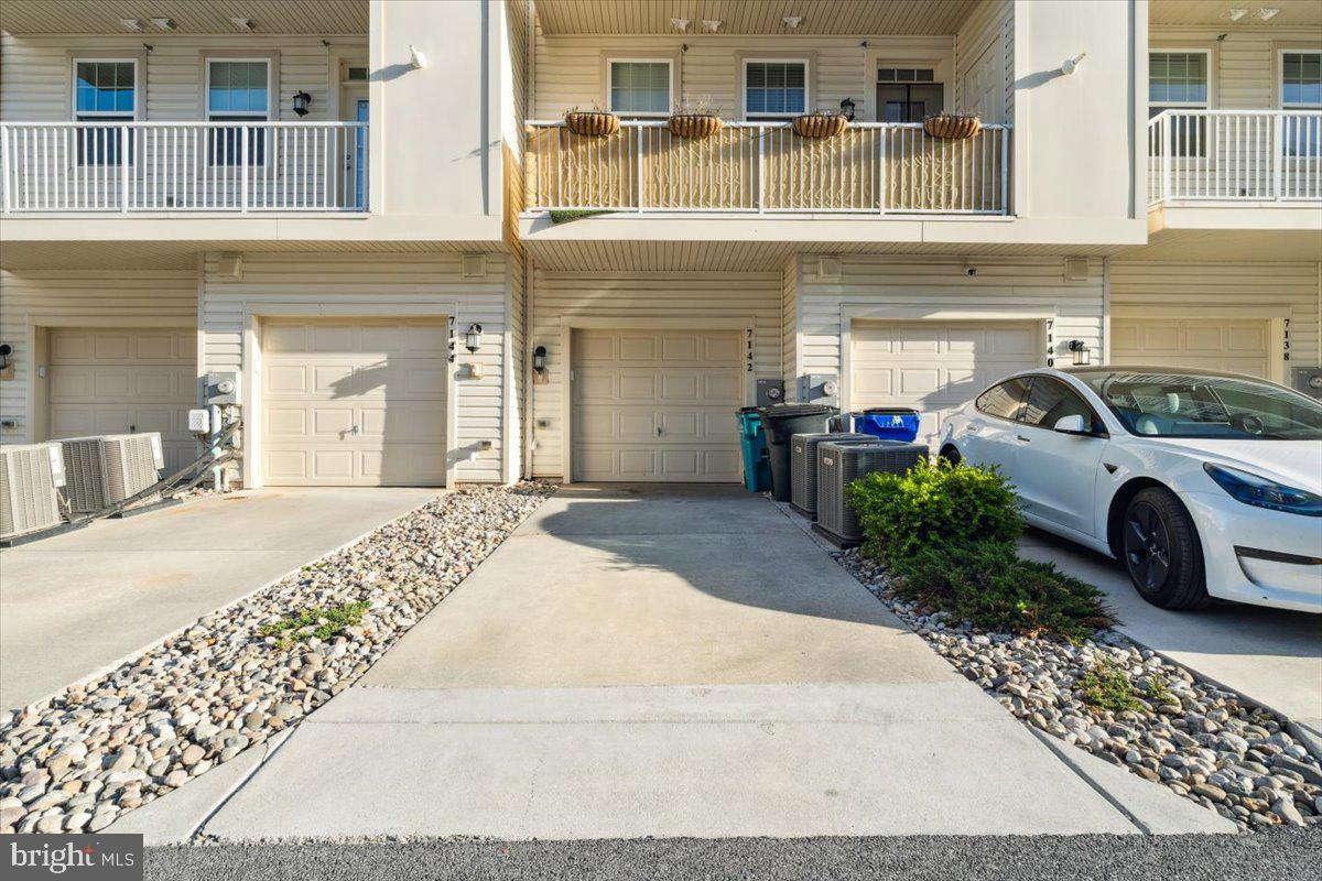 7142 Proclamation Place Frederick, MD 21703 - Photo 35 of 37 a front view of a building with parking space