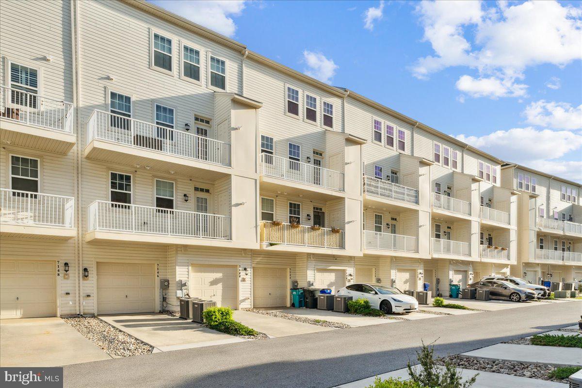 7142 Proclamation Place Frederick, MD 21703 - Photo 36 of 37 a front view of a building with street view