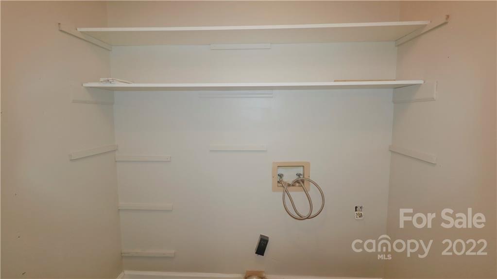 3612 Redstones Road Charlotte, NC 28212 - Photo 11 of 11 a bathroom with a glass shower door