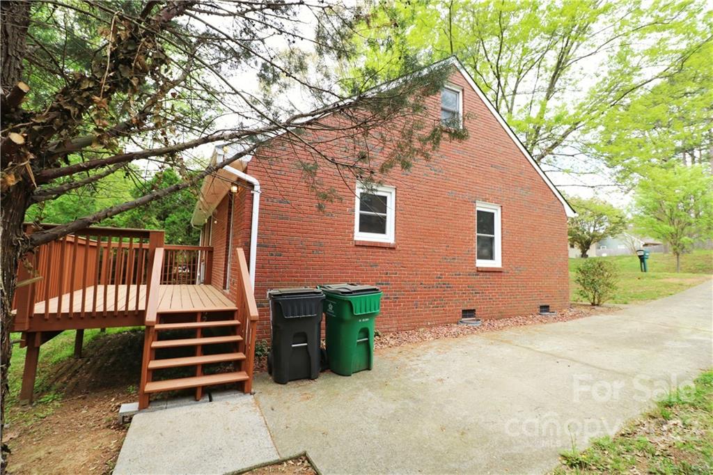 3612 Redstones Road Charlotte, NC 28212 - Photo 2 of 11 a view of backyard with deck and outdoor seating