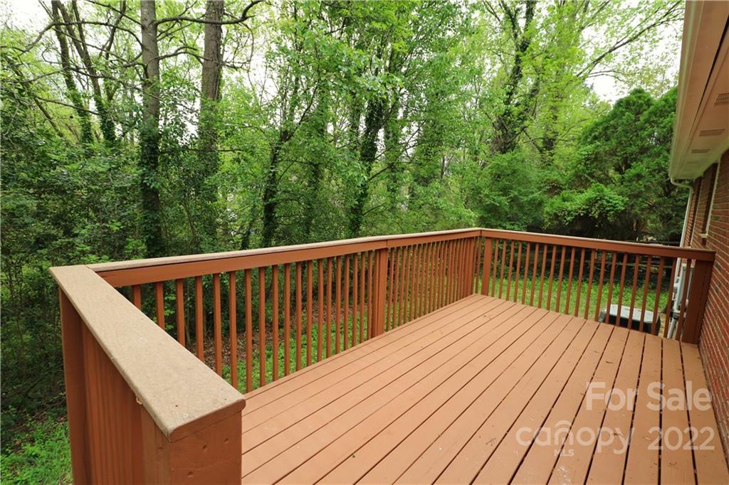 3612 Redstones Road Charlotte, NC 28212 - Photo 3 of 11 a view of balcony with wooden floor and fence