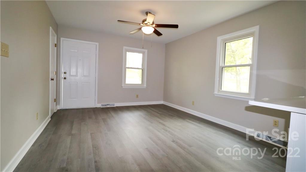 3612 Redstones Road Charlotte, NC 28212 - Photo 5 of 11 a view of a room with wooden floor and a window