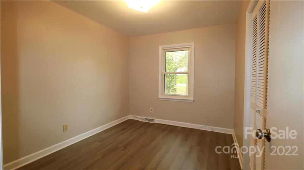 3612 Redstones Road Charlotte, NC 28212 - Photo 8 of 11 an empty room with a window