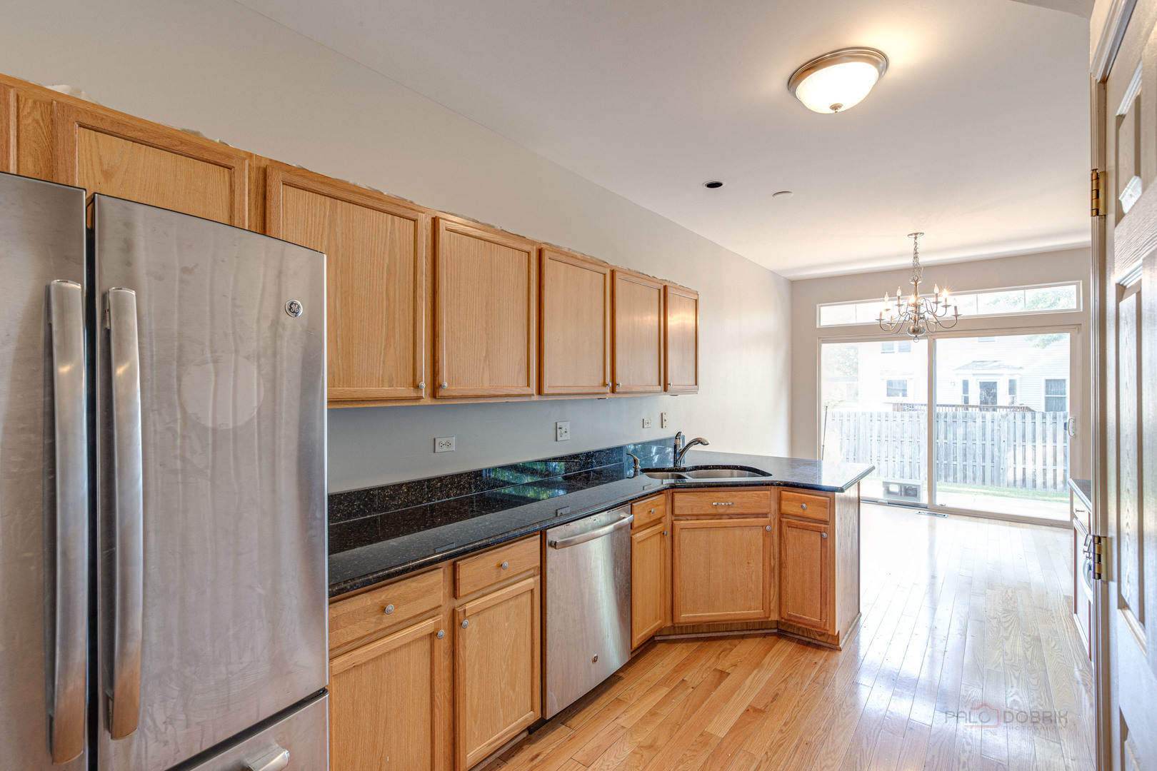 1655 Windward Court Naperville, IL 60563 - Photo 16 of 34 a kitchen with stainless steel appliances a refrigerator sink and cabinets