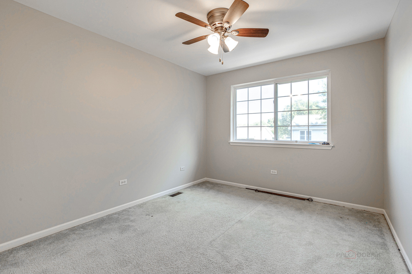 1655 Windward Court Naperville, IL 60563 - Photo 23 of 34 an empty room with a window and a fan
