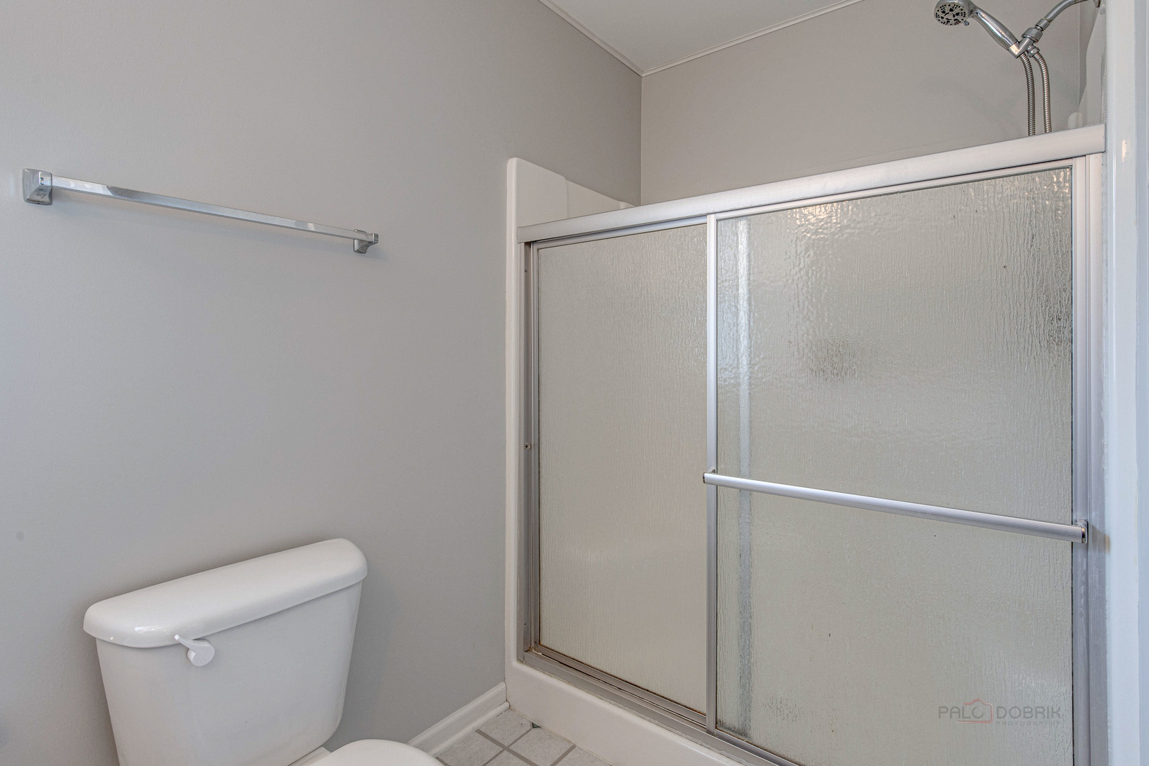 1655 Windward Court Naperville, IL 60563 - Photo 28 of 34 a bathroom with a toilet and a shower