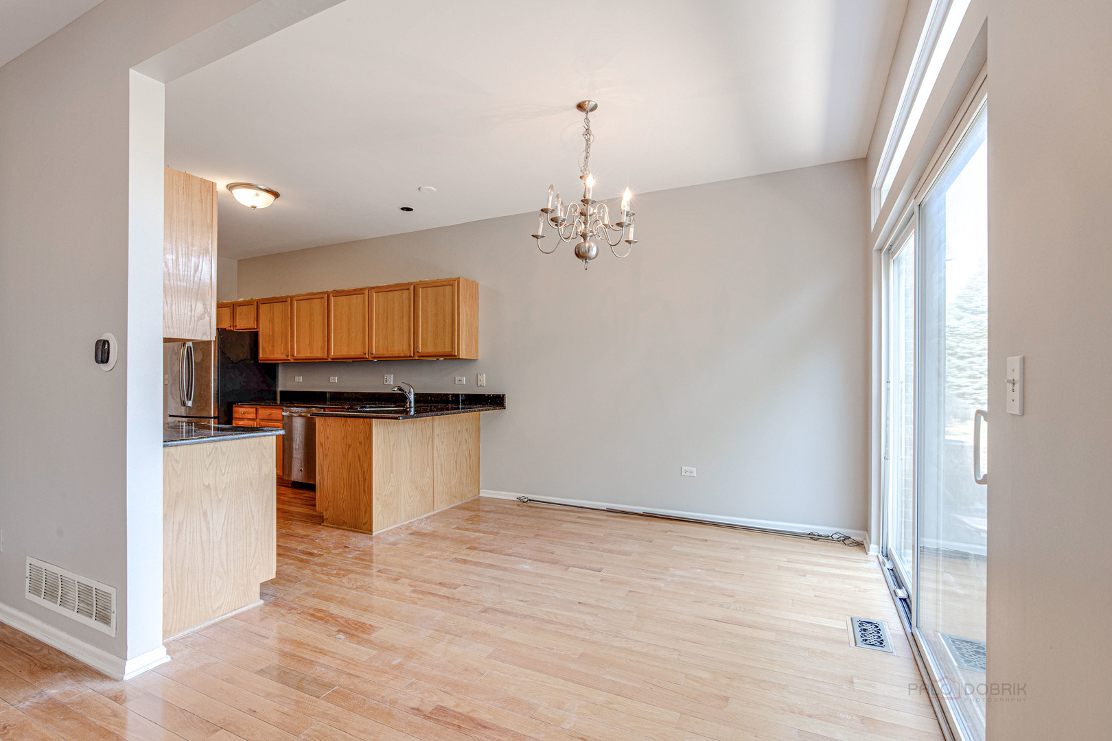 1655 Windward Court Naperville, IL 60563 - Photo 10 of 34 a view of kitchen with granite countertop cabinets and wooden floor