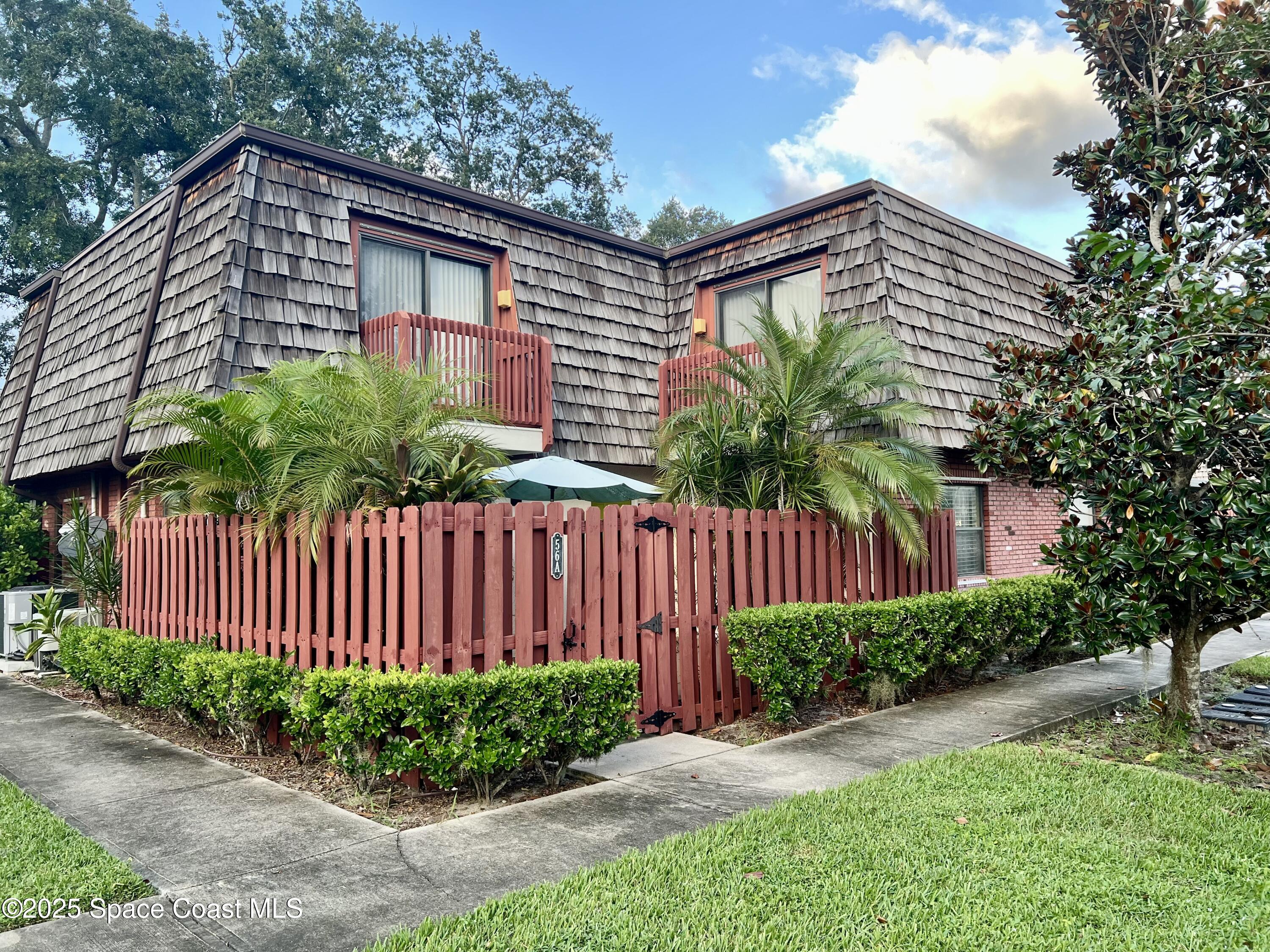 56 Piney Branch Way, Unit A Melbourne, FL 32904 - Photo 1 of 17 a house view with a garden space