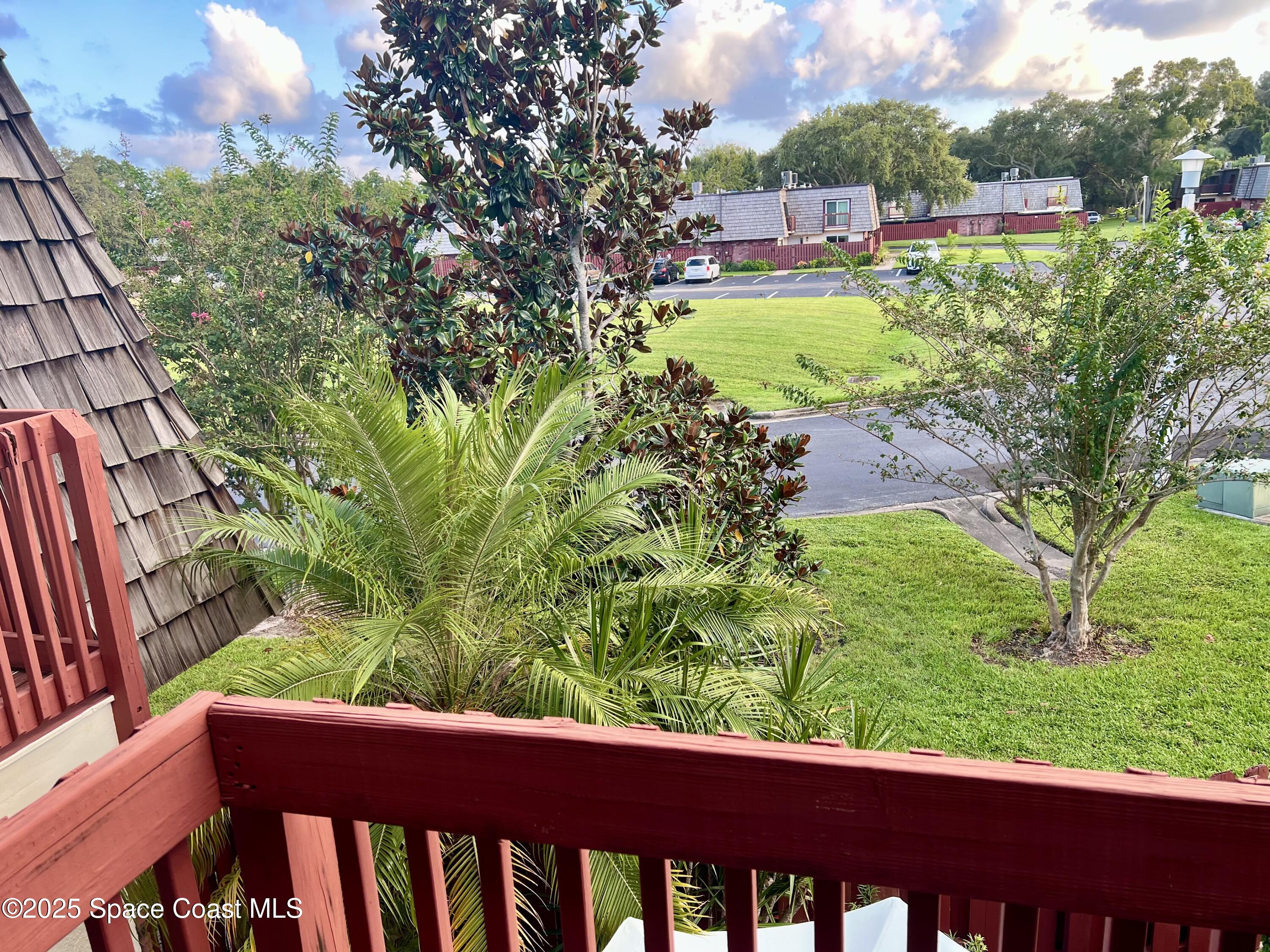 56 Piney Branch Way, Unit A Melbourne, FL 32904 - Photo 12 of 17 a view of a garden from a balcony