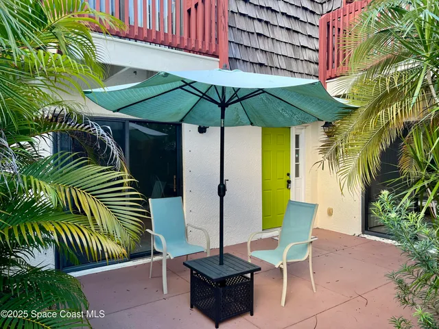 a kitchen with stainless steel appliances granite countertop a table chairs sink and cabinets