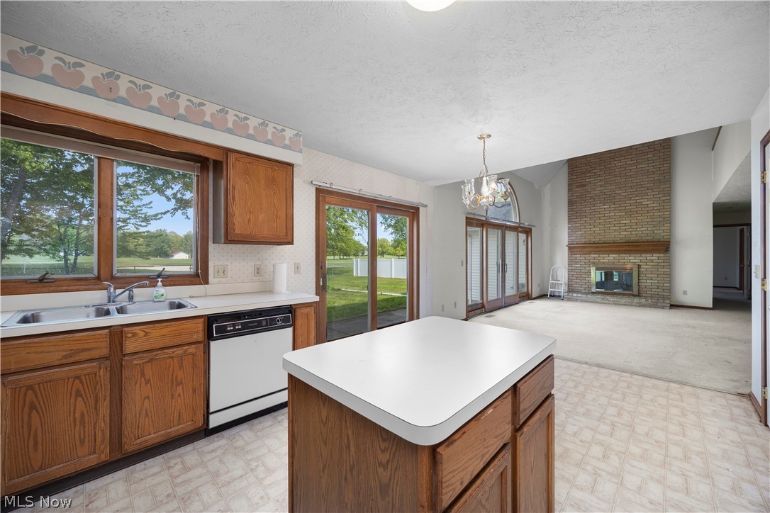 722 Jaycox Road Avon Lake, OH 44012 - Photo 10 of 48 Kitchen with wood-finish cabinetry, white countertops, and vinyl flooring