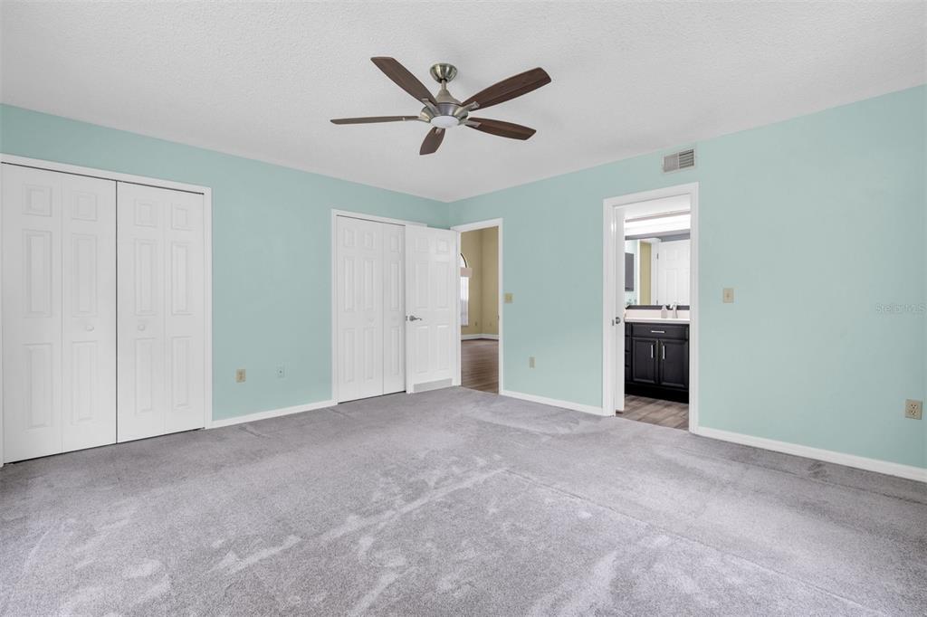 7230 Hummingbird Lane New Port Richey, FL 34655 - Photo 18 of 41 a view of an empty room with a ceiling fan and a window