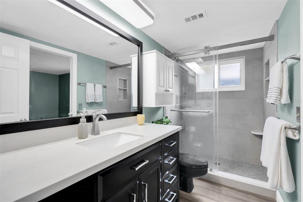 7230 Hummingbird Lane New Port Richey, FL 34655 - Photo 19 of 41 a bathroom with a sink and a mirror