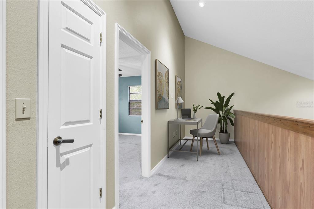 7230 Hummingbird Lane New Port Richey, FL 34655 - Photo 20 of 41 a view of a hallway with chairs and front door