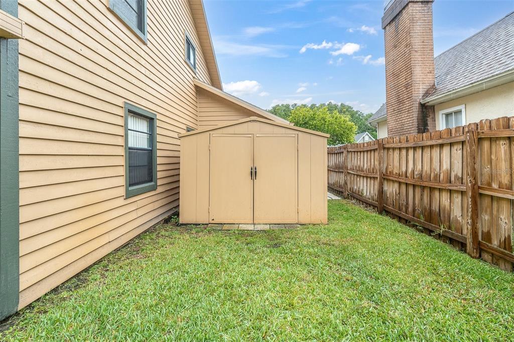 7230 Hummingbird Lane New Port Richey, FL 34655 - Photo 31 of 41 a view of a house with a yard