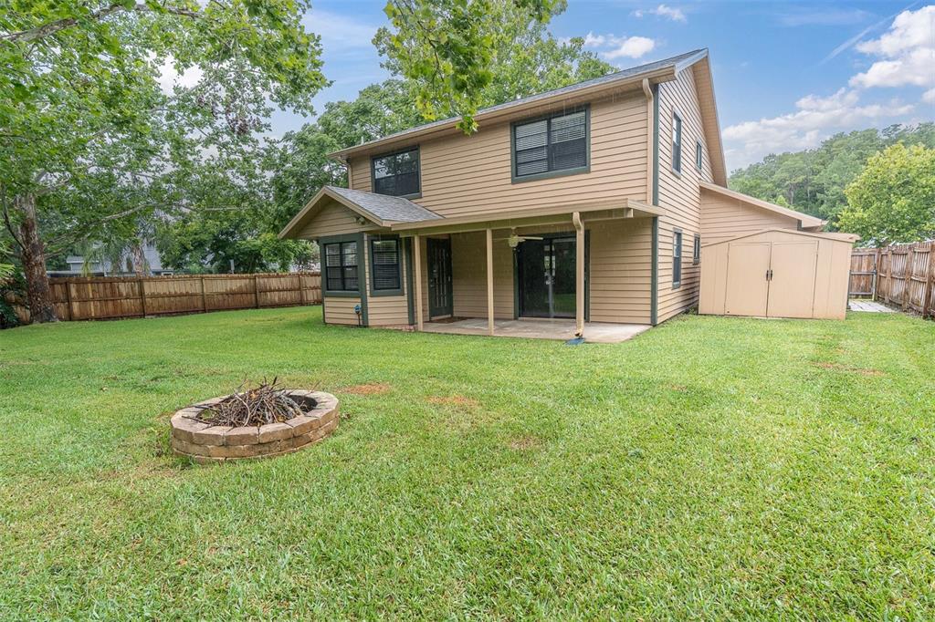 7230 Hummingbird Lane New Port Richey, FL 34655 - Photo 36 of 41 a view of a house with a yard